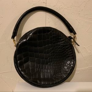 Clare V. croc embossed leather circle clutch